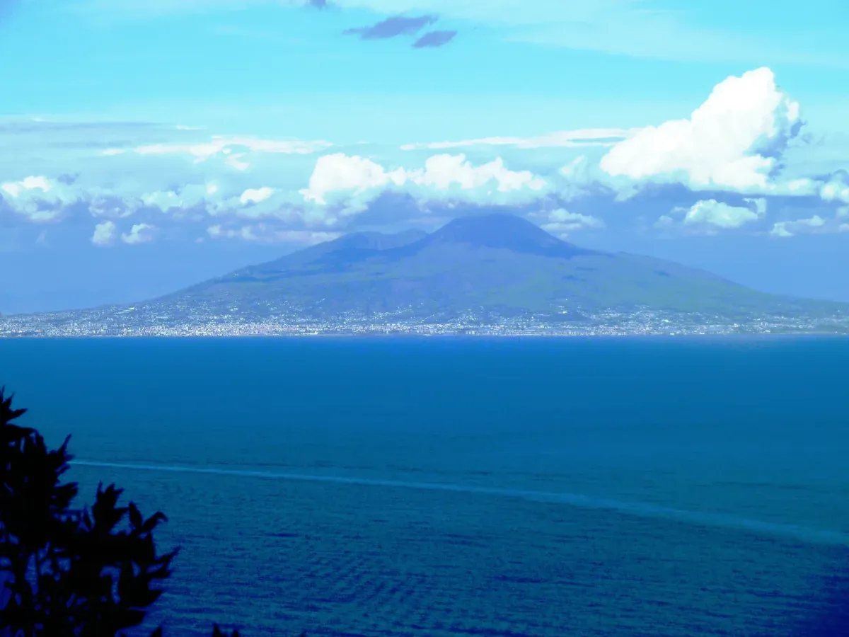 Mount Vesuvius seen across the Gulf of Naples from the water on the Capri sightseeing boat tour from Naples, Italy